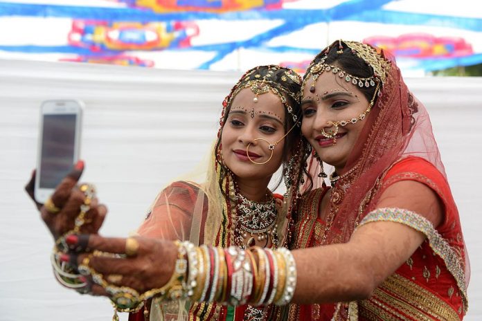 women with a phone taking a selfie